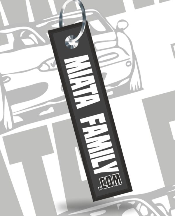 Custom Miata Family keychain with black tag and white text, perfect for Mazda Miata enthusiasts and car lovers.
