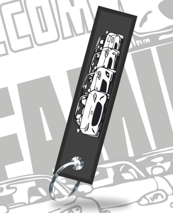 Keychain featuring a detailed miniature of a Mazda Miata sports car.