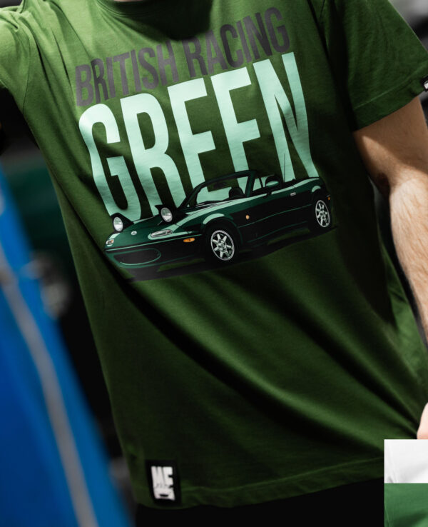 Close-up of a person wearing a British Racing Green Miata-themed T-shirt, showcasing the car graphic and bold text on a casual green shirt.