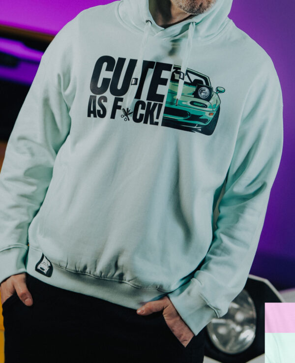 Hoodie featuring a graphic of a sports car and the phrase "CUTE AS F*CK" in bold letters, perfect for car enthusiasts and Miata fans.