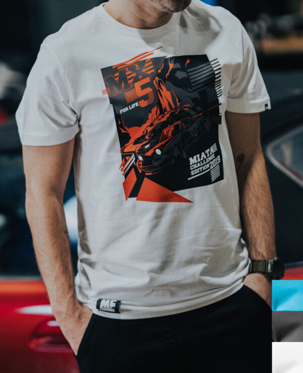 Close-up of a person wearing a Miata racing-themed T-shirt featuring a car and bold graphics, ideal for Miata enthusiasts and car racing fans.