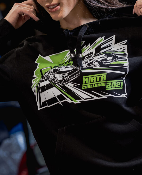 Hoodie featuring the Miata Challenge 2021 logo with racing cars and dynamic graphics, perfect for Mazda Miata enthusiasts and car event fans.