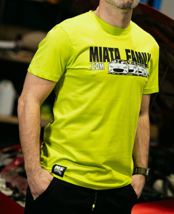 Bright yellow Miata Family.com T-shirt featuring a graphic of Mazda Miata cars, perfect for car enthusiasts and Miata fans.