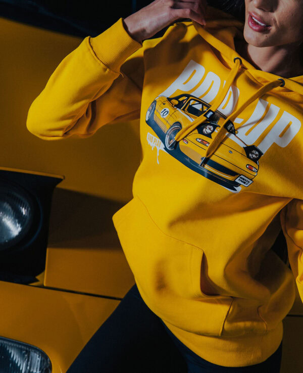 Hoodie featuring a detailed graphic of a yellow Mazda Miata, perfect for car enthusiasts and Miata fans.