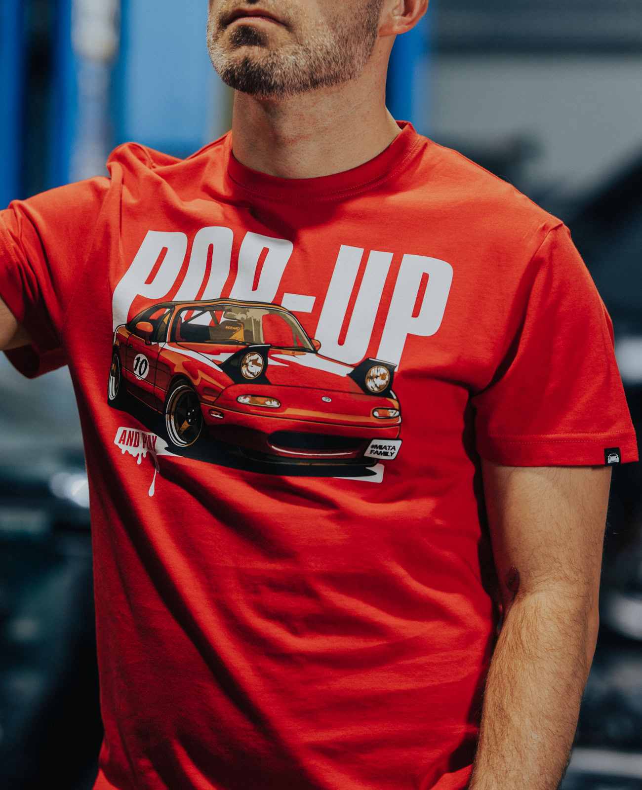 Red Mazda Miata graphic T-shirt featuring a classic car design, perfect for Miata lovers and automotive enthusiasts.