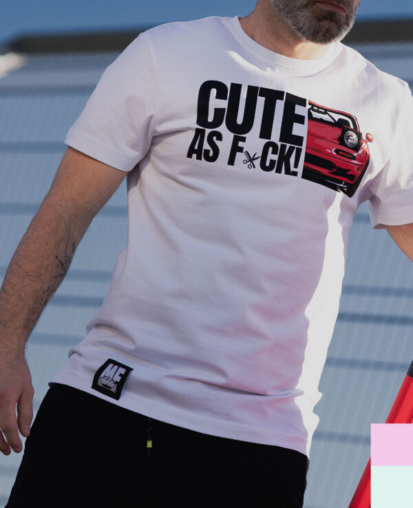 White T-shirt featuring a fun graphic of a red Mazda Miata with the phrase "CUTE AS F*CK!" for car lovers and Miata fans. Perfect casual wear for automotive enthusiasts.