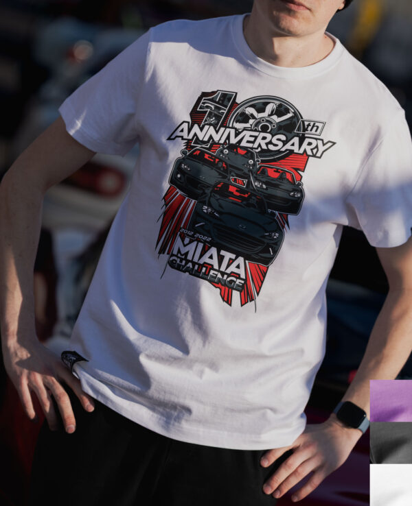 Person wearing a Miata 10th Anniversary T-shirt celebrating Mazda Miata's milestone with a graphic design of a Miata car and anniversary logo.